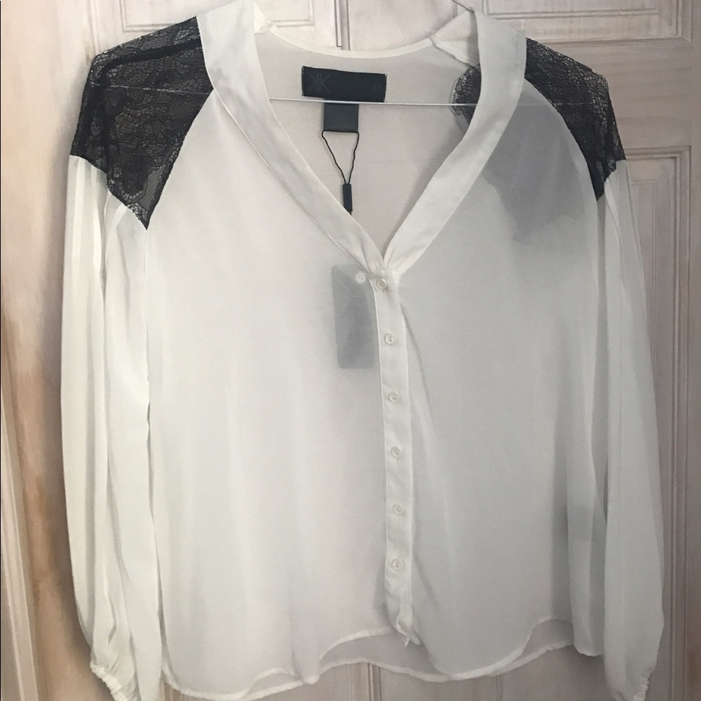 White kardashian blouse with black lace shoulders