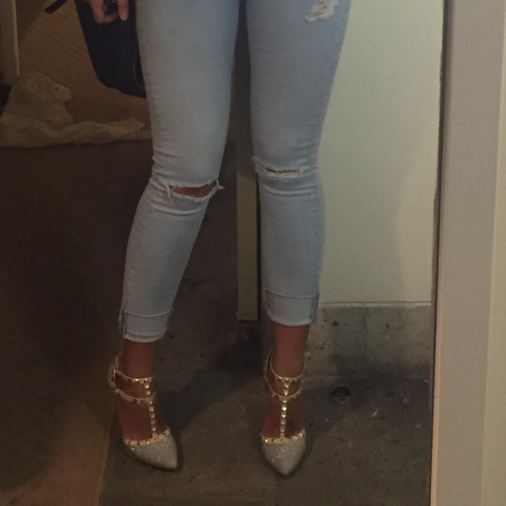 Nude heels with studs across ankle straps.