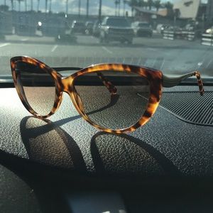 Alexander McQueen sunglasses.