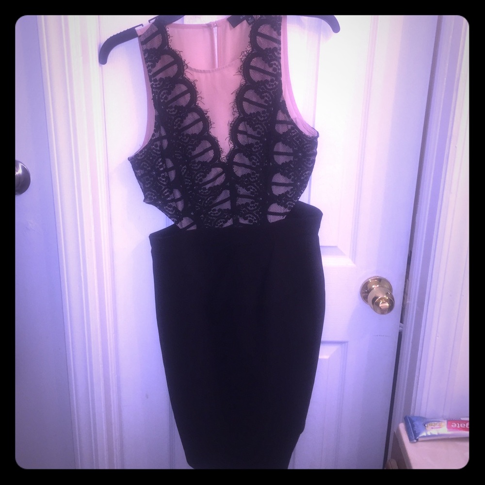 Cocktail dress with side cutouts.