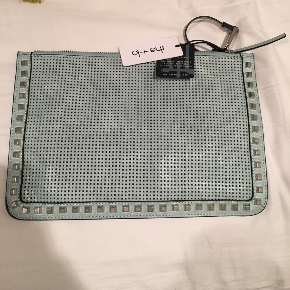 She Lo blue studded clutch bag.
