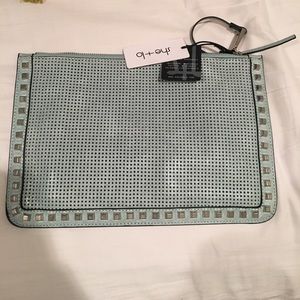 She Lo blue studded clutch bag.