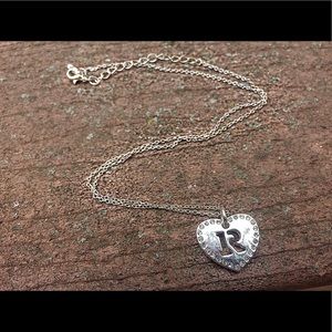 Silver heart charm necklace with R cutout