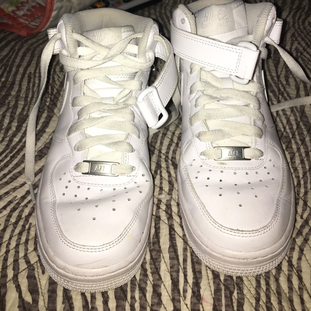 Nike Air Force 1 high top shoes.