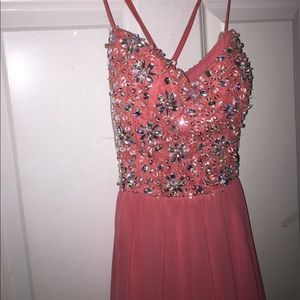 An embellished coral short prom/homecoming dress