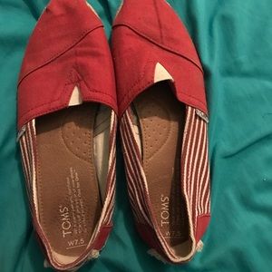 Red and white TOMS shoes