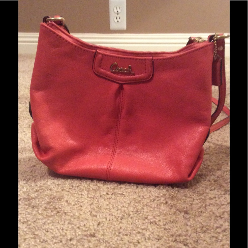Peach Coach crossbody bag