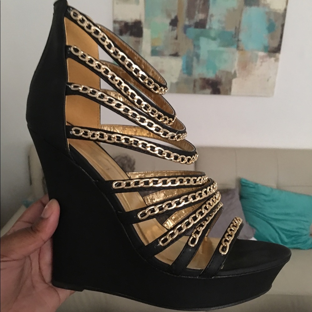 Black heels with gold chain embellishments