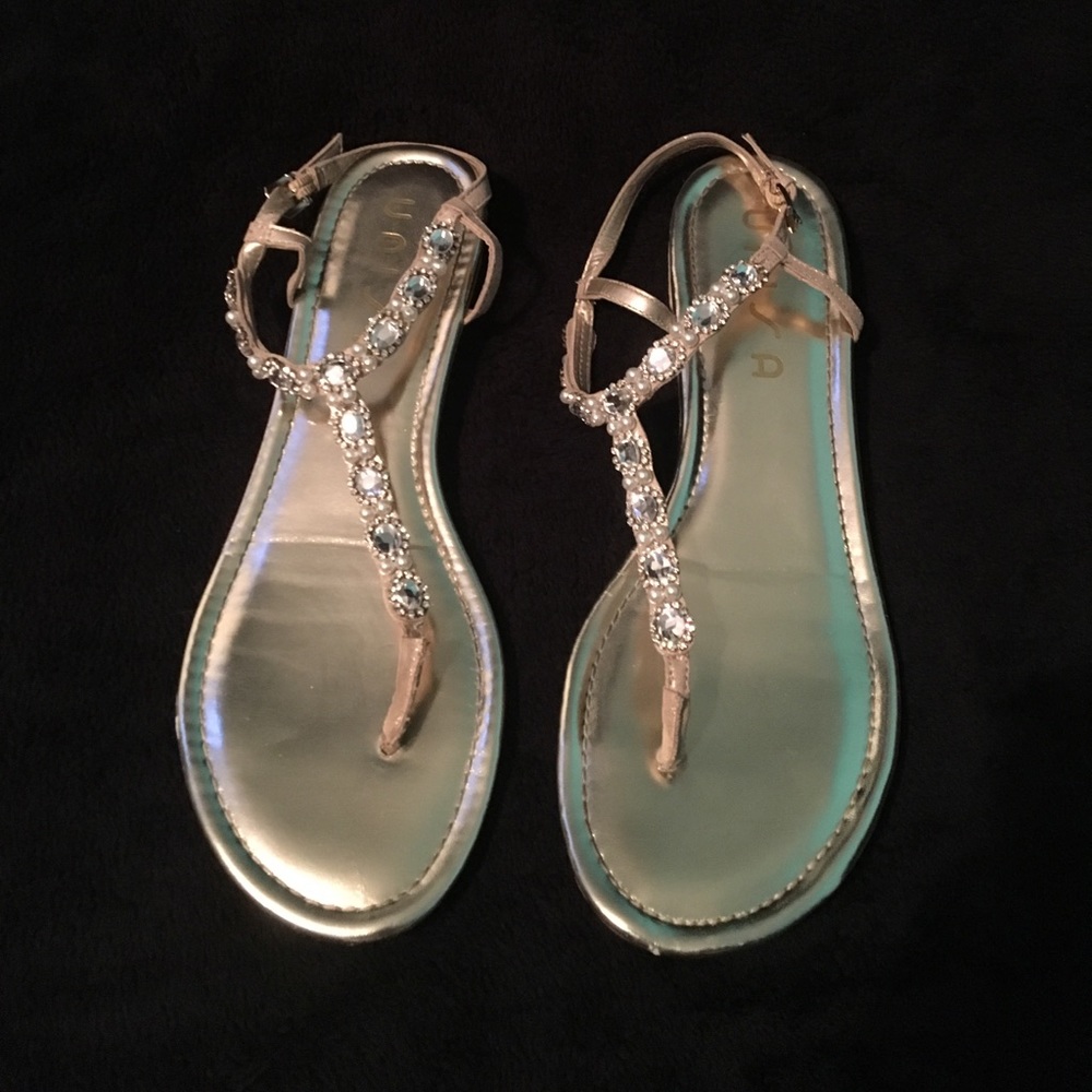 Gold sparkly jeweled sandals.