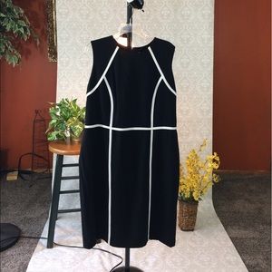 Black Calvin Klein sleeveless sheath dress.