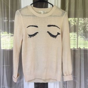 F21 Outlined Eyes White Sweater