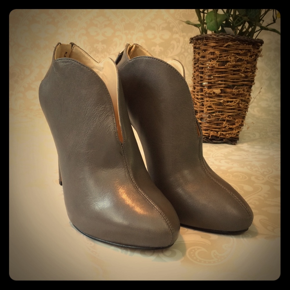 Nine West Gray high heeled ankle booties.