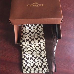 Beautiful tan and brown silk coach scarf. Use