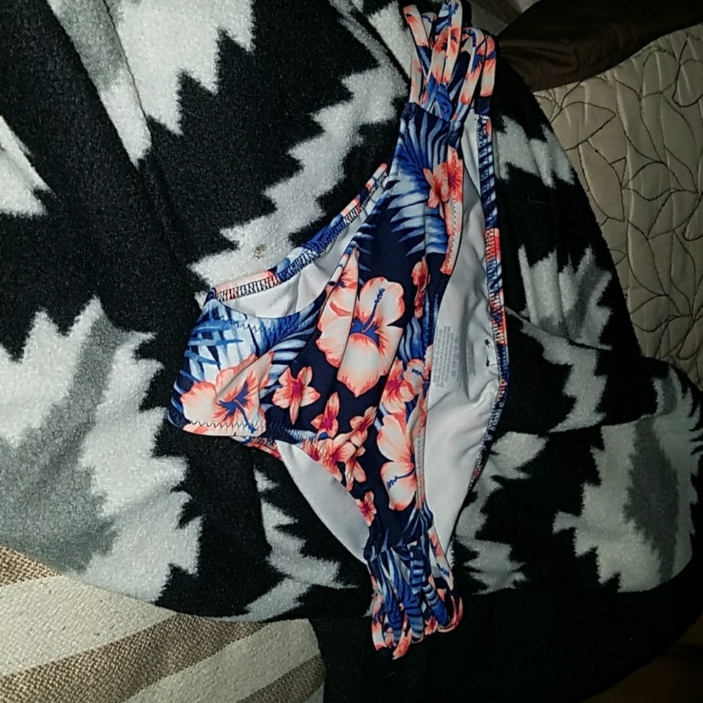 Pink vs woman's top and bottom swim suit.