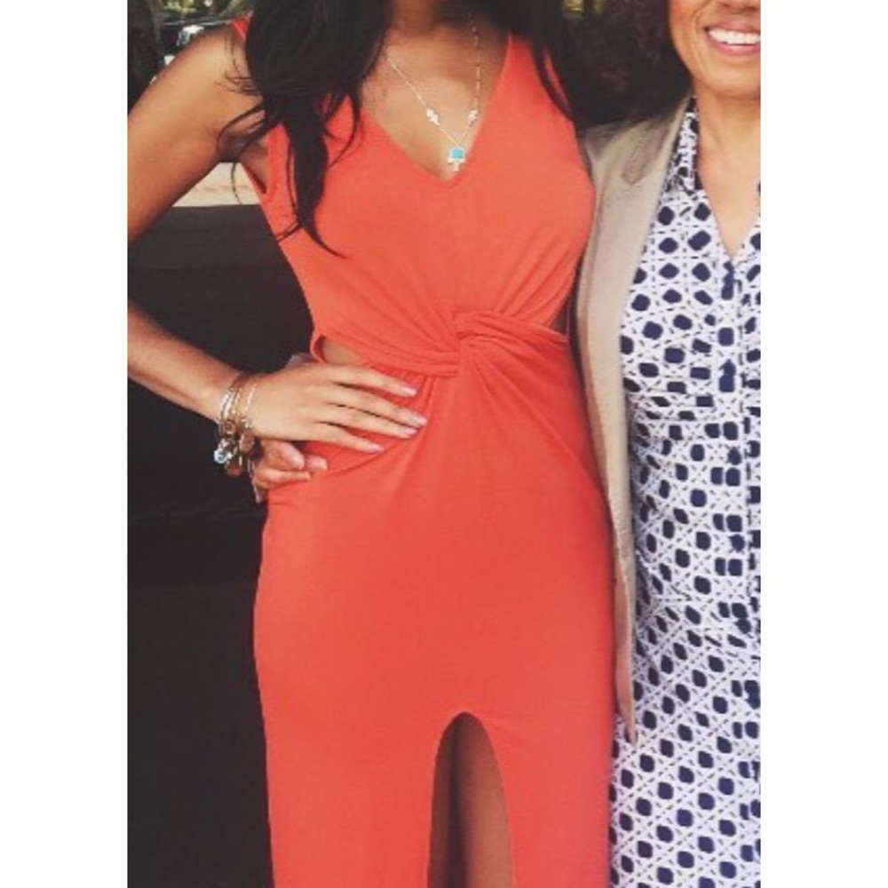 Beautiful orange midi dress with dramatic slit