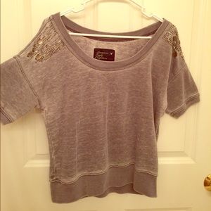 Gently worn small bead missing from left shoulder