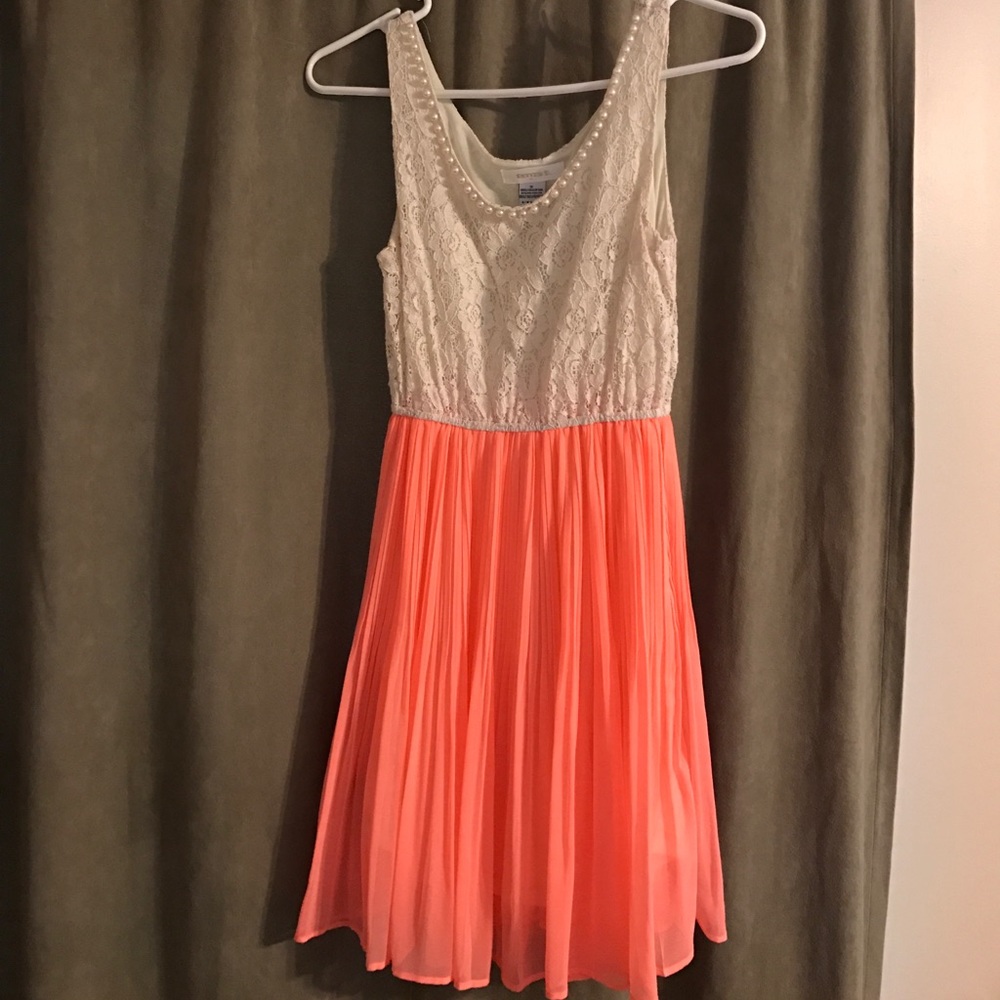 White lace and coral dress with pearl neckline