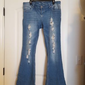 Ariya machine distressed light wash jeans. Flare