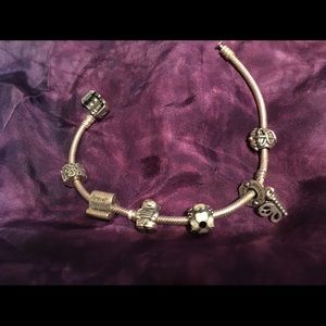 Pandora bracelet with 5 charms and 1 stopper bead