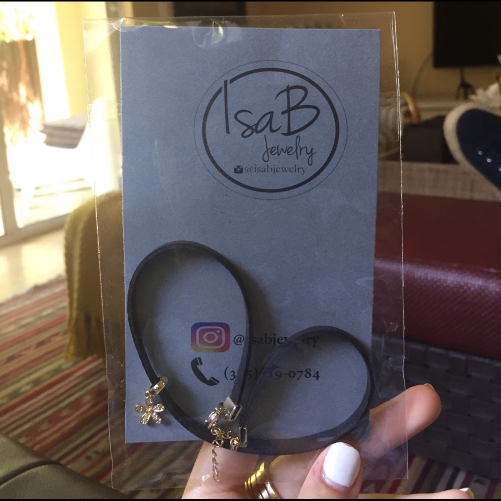 Black choker with gold flower