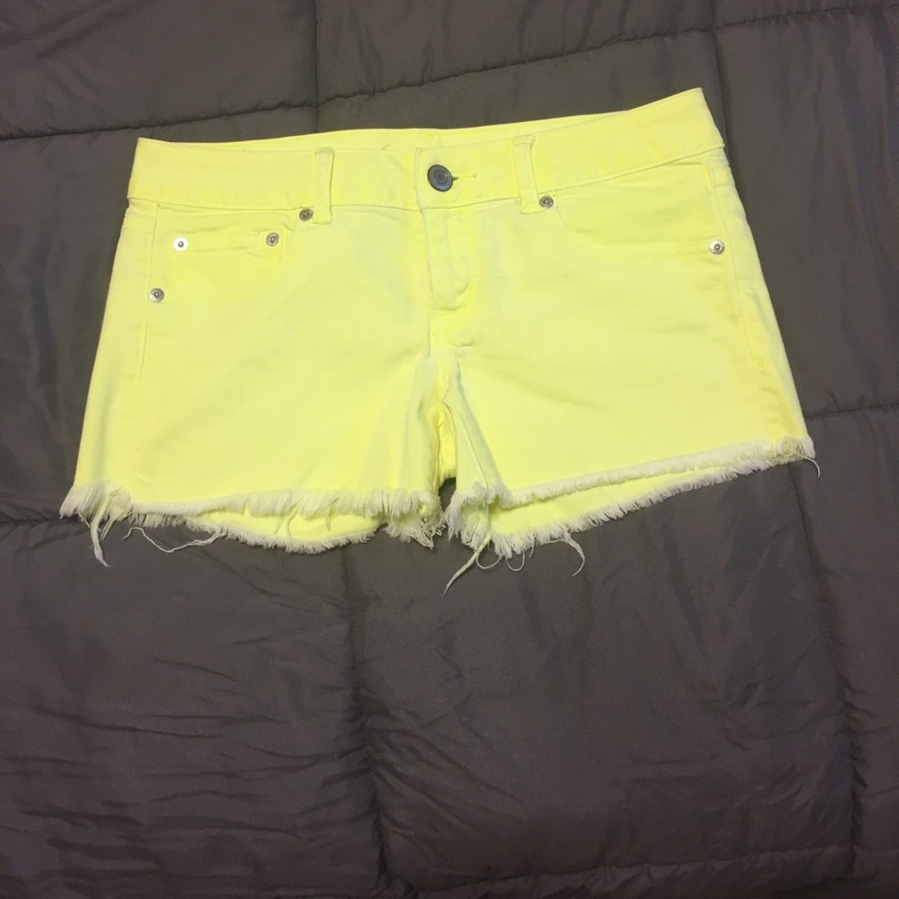 Fluorescent yellow frayed shorts
