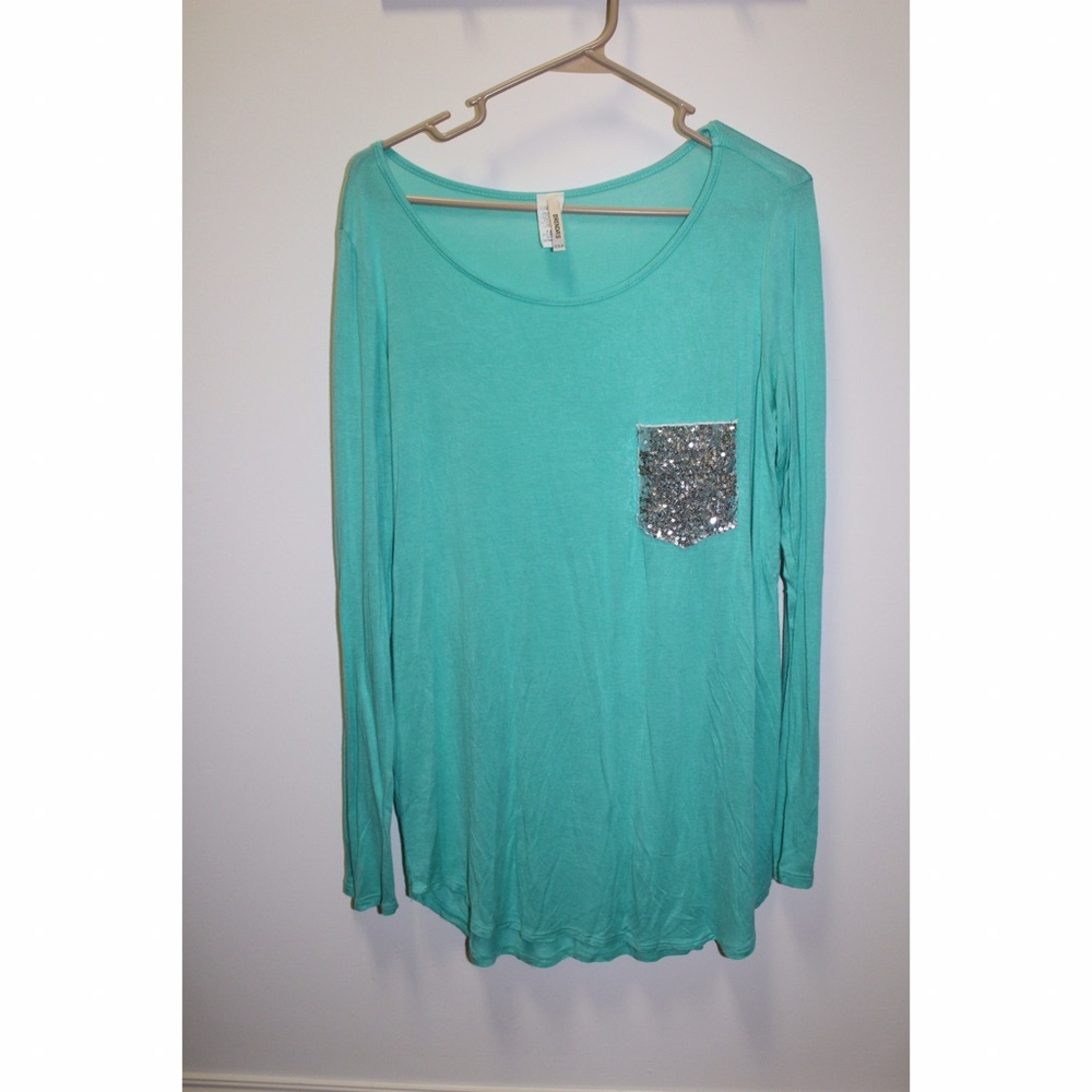 Aqua tunic with silver sparkly fake pocket.