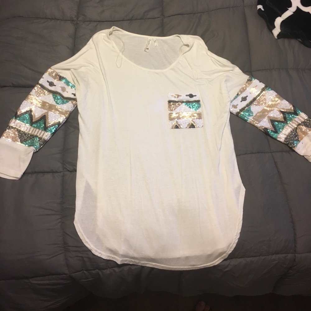White blouse with accented sequin pattern