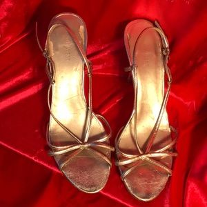 Golden strappy pumps by Nine West