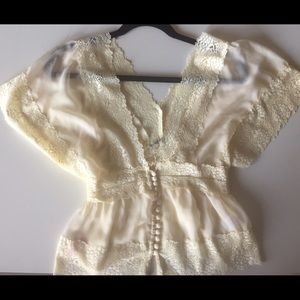 Lace low cut blouse with button-front detailing