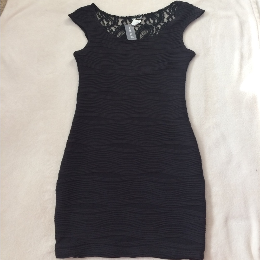 Tight black dress with lace back detailing