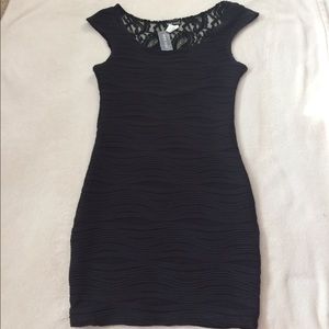 Tight black dress with lace back detailing