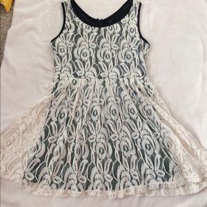 Black dress with white lacy covering