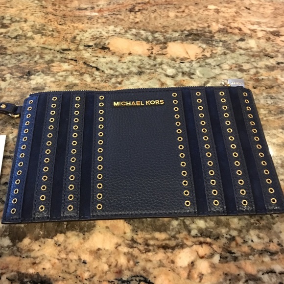 Michael Kors Handbags - New Michael Kors zippered grommet clutch.