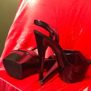 Shiny black pleaser platforms