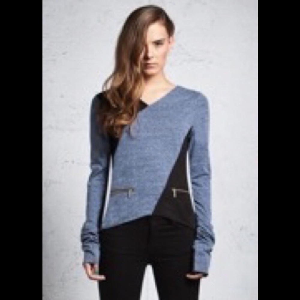 Long sleeve color block shirt with zipper detail.