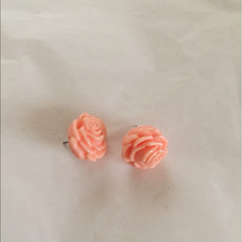 Pink rosette stud earrings .