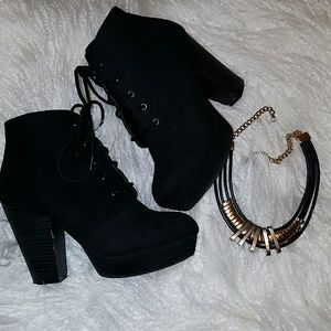 Black lace up velvet booties.