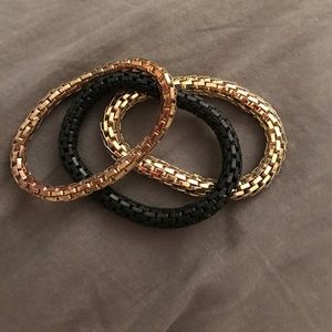 Gold, rose gold, and black bracelet set
