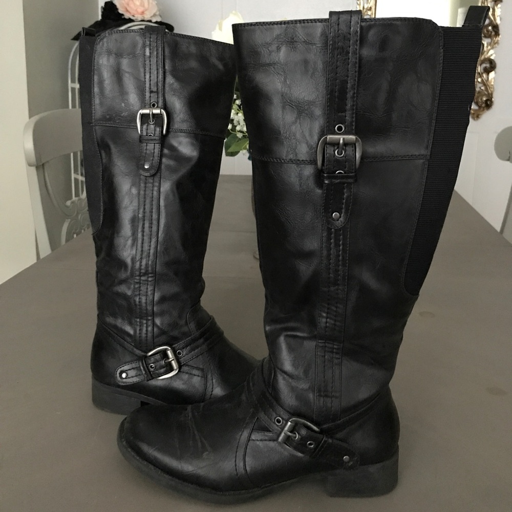 Wide calf, knee high black boots.