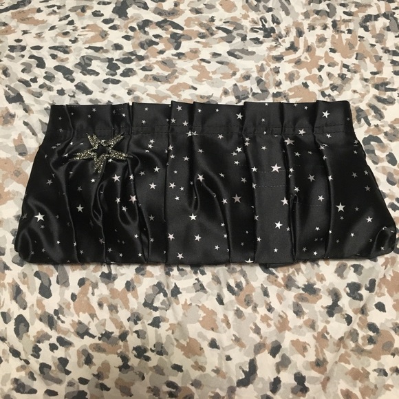 Express Handbags - Express black with white stars clutch Never used