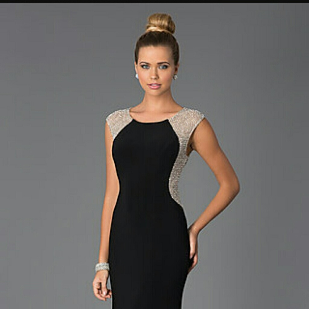 Elegant black Xscape gown with silver beads...
