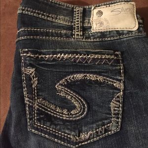 Silver medium wash bootcut jeans.