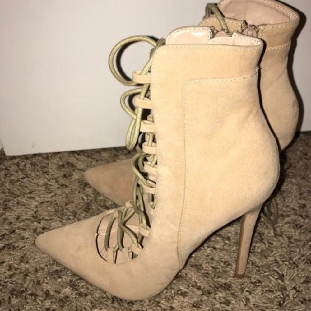 Cream laced booties must be a heel walker
