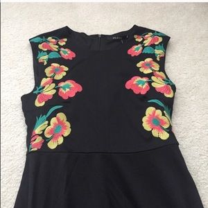 Black cocktail dress with floral detail
