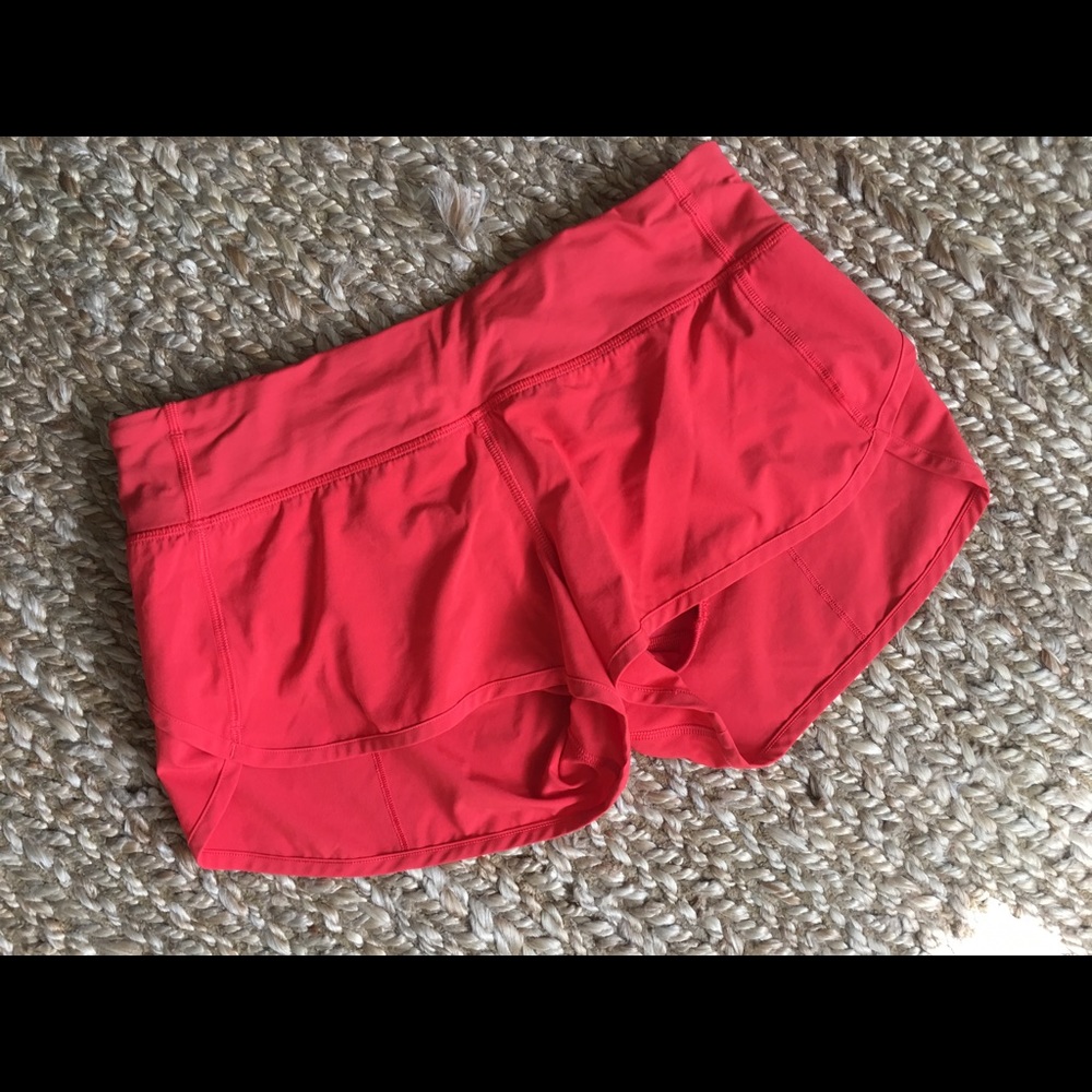 Lululemon orangey/red running shorts