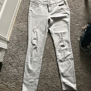Light grey distressed skinny jeans