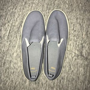 Navy, black, and blue slip on shoes. Navy, black, and blue slip on shoes.