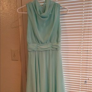 Teal dress that falls right above the knee.