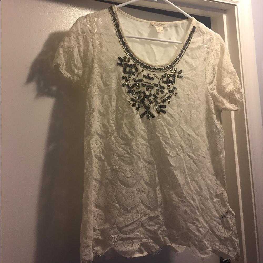 Beaded lace blouse.