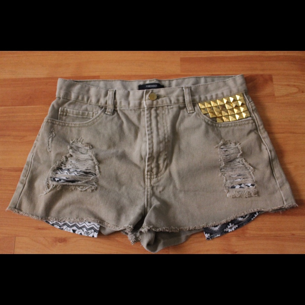 faded green distressed shorts
